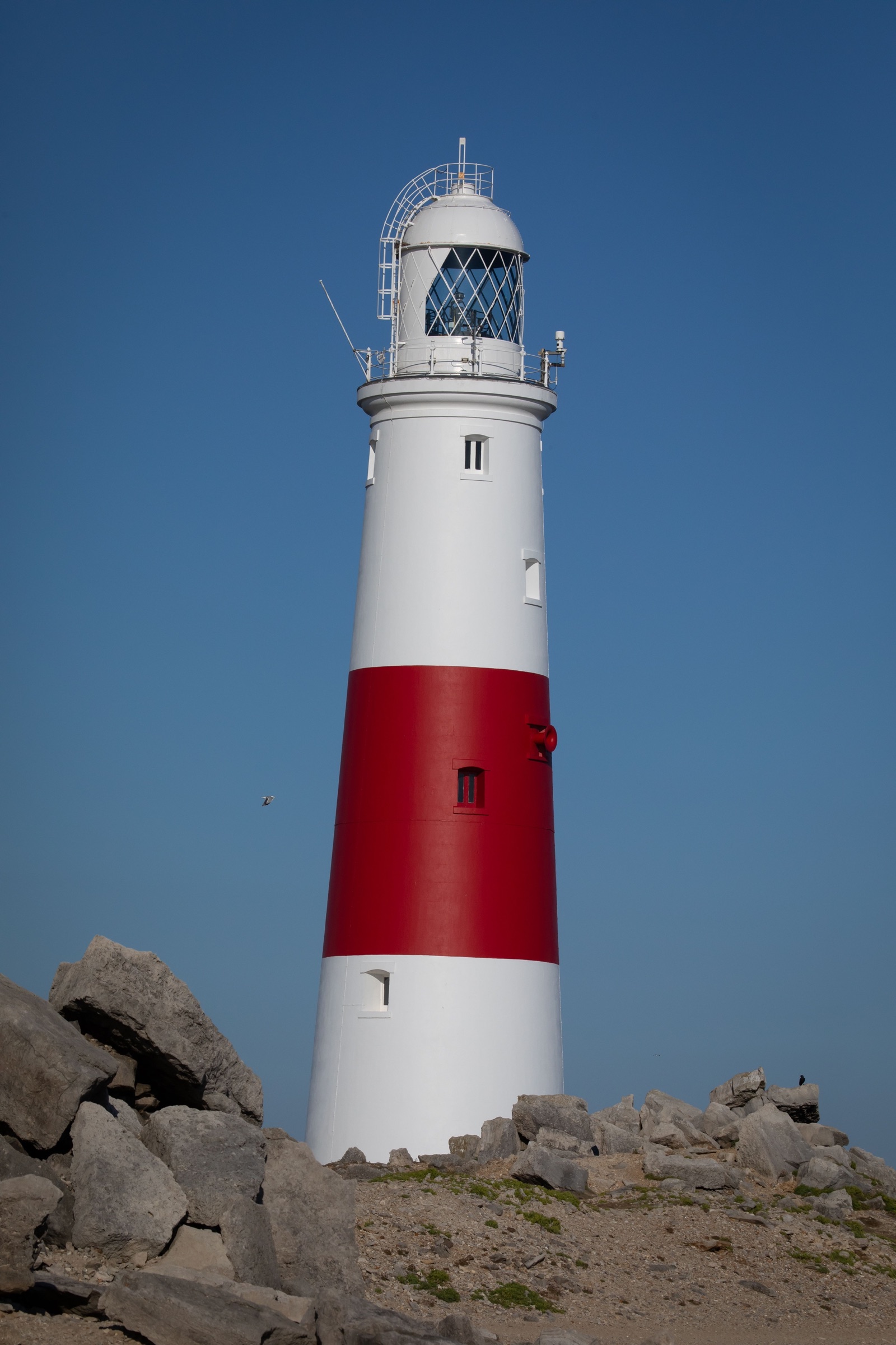 Portland Bill Lighthouse, painted in its distinctive red and white stripes, Dorset