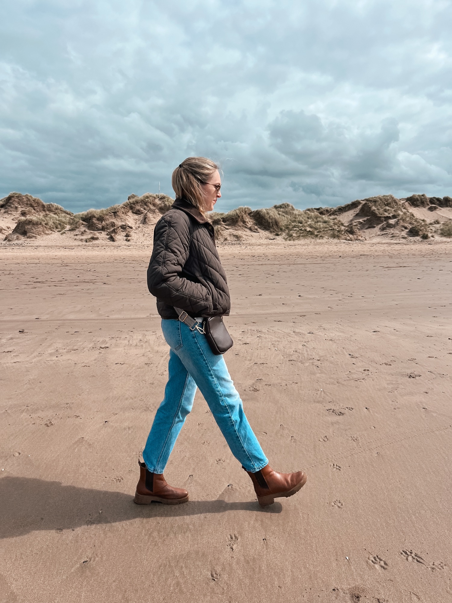 Walking along the sand at Saunton with the dunes of Braunton Burrows behind