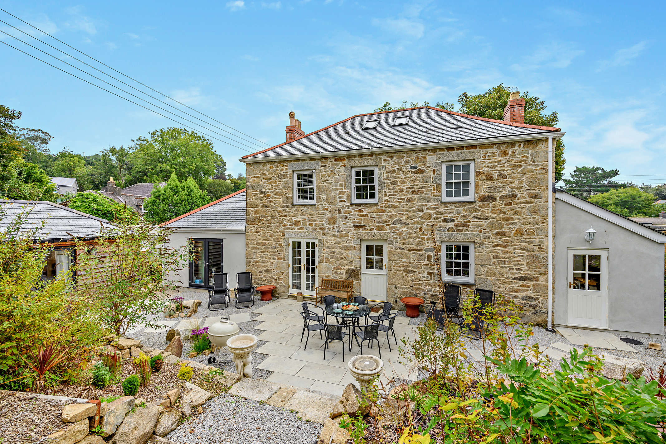 The granite farmhouse exterior at The Falmouth Garden House, Falmouth Cornwall
