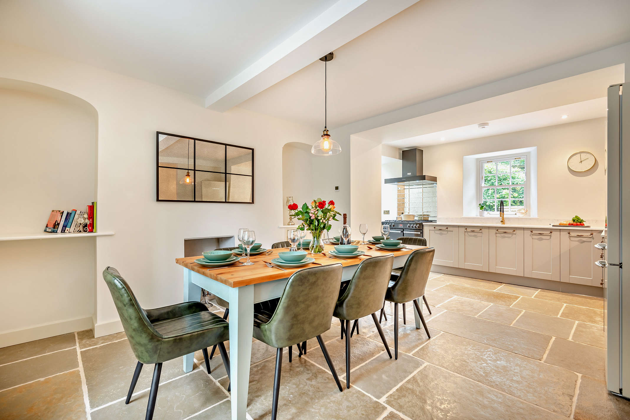 The kitchen and dining area at The Falmouth Garden House with limestone flooring