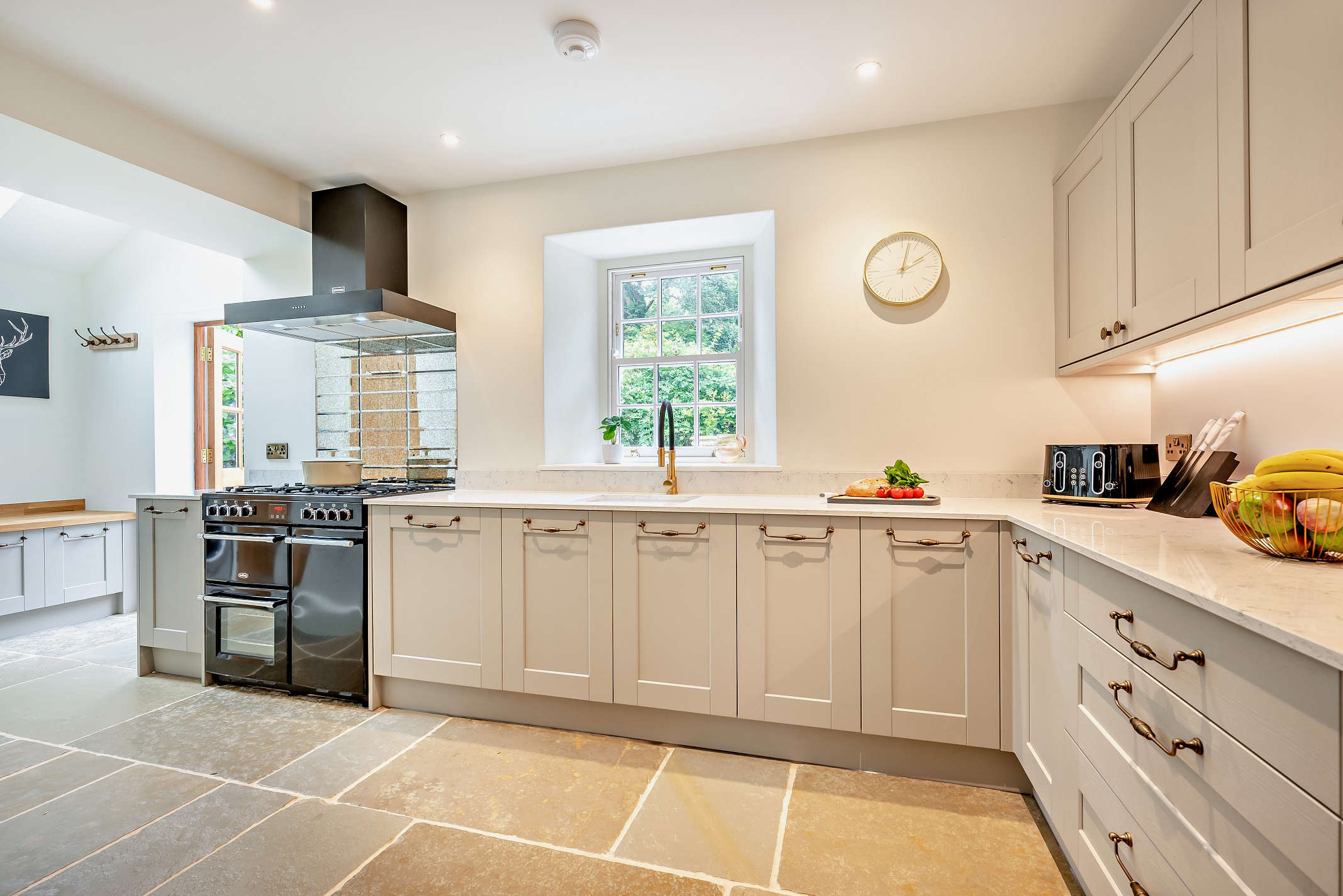 The kitchen with quartz worktops and dual-fuel range at The Falmouth Garden House