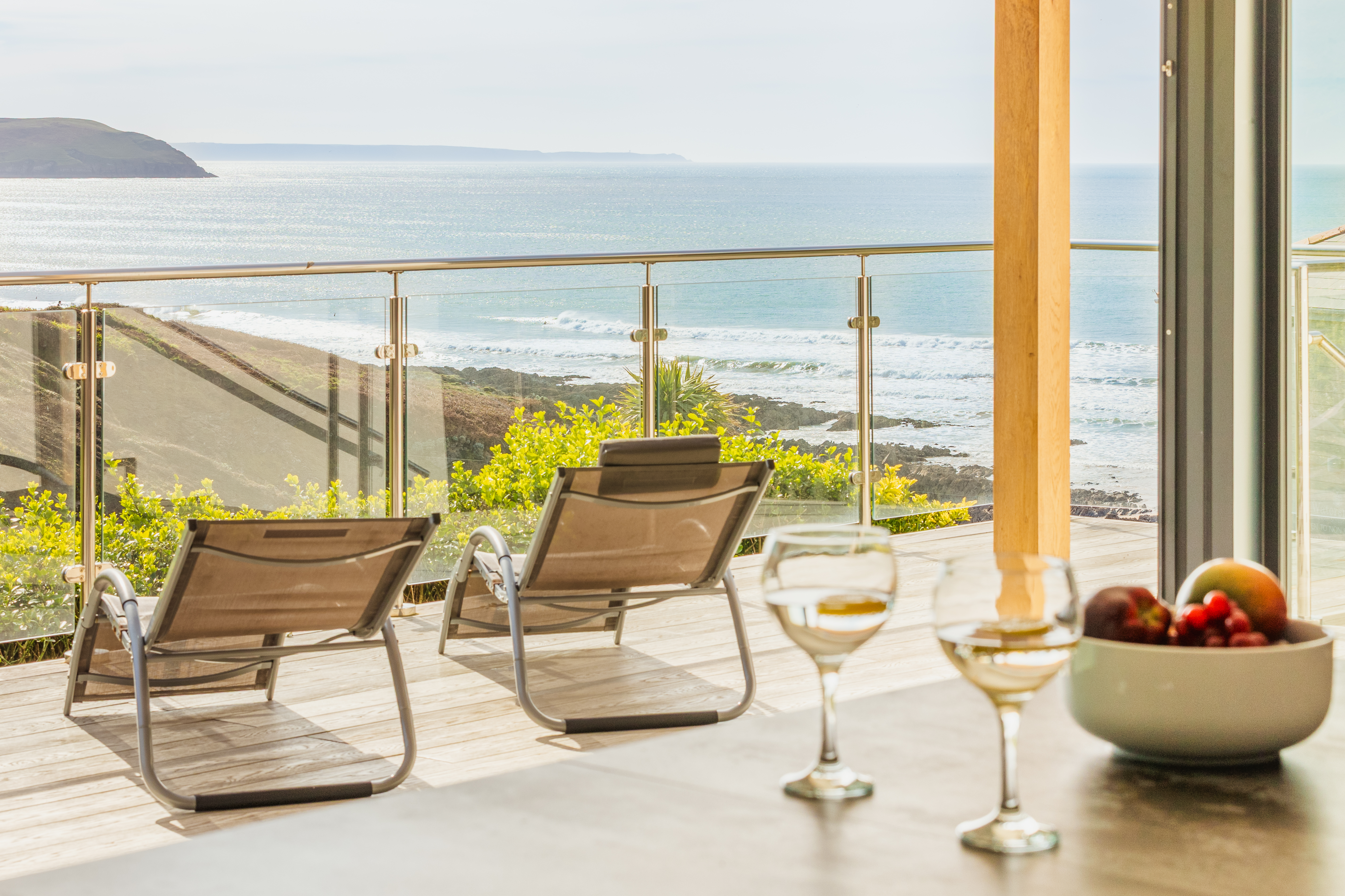The glass-fronted decked terrace with panoramic Atlantic views at The Mortehoe Clifftop House