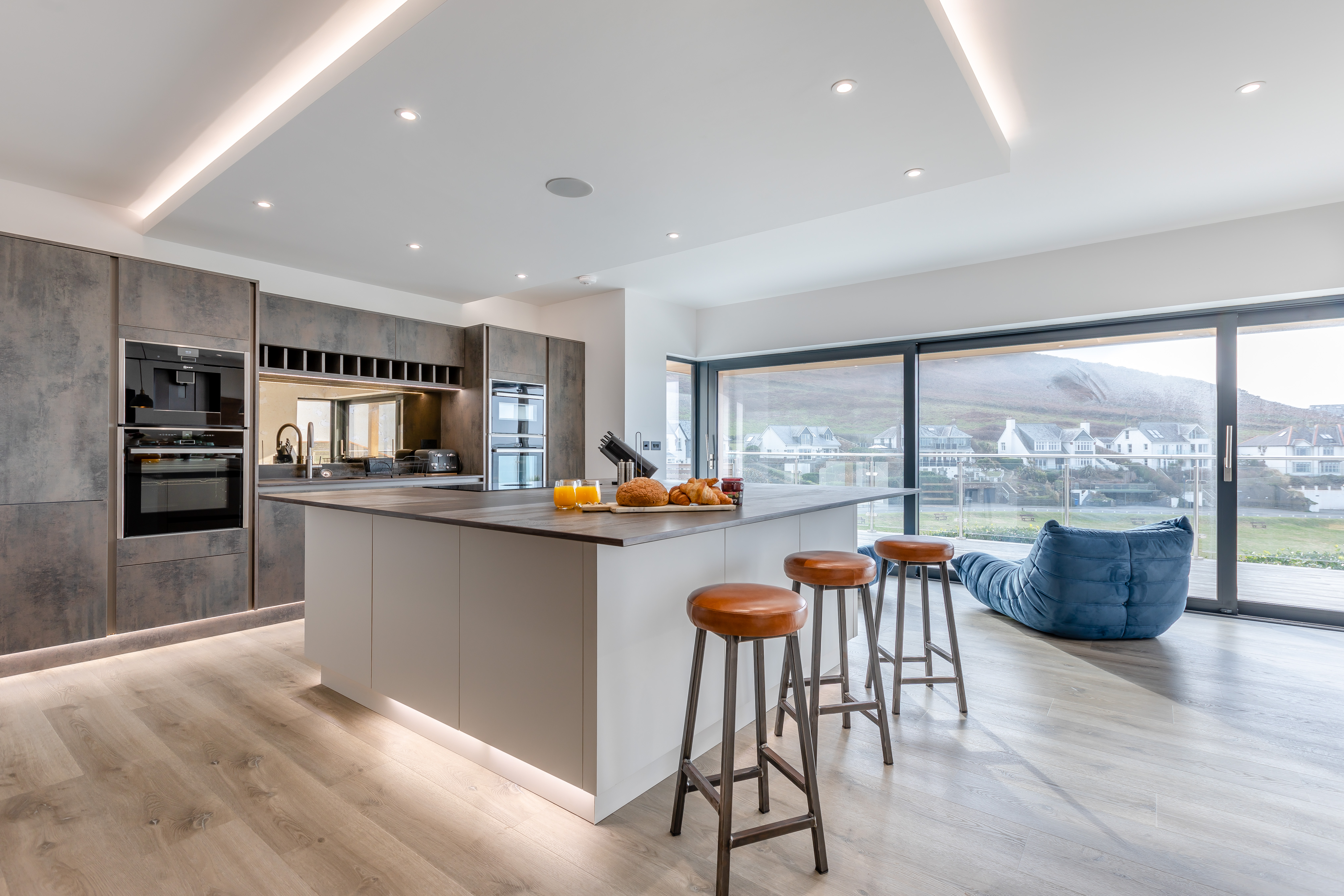 The contemporary open-plan kitchen at The Mortehoe Clifftop House dog-friendly cottage