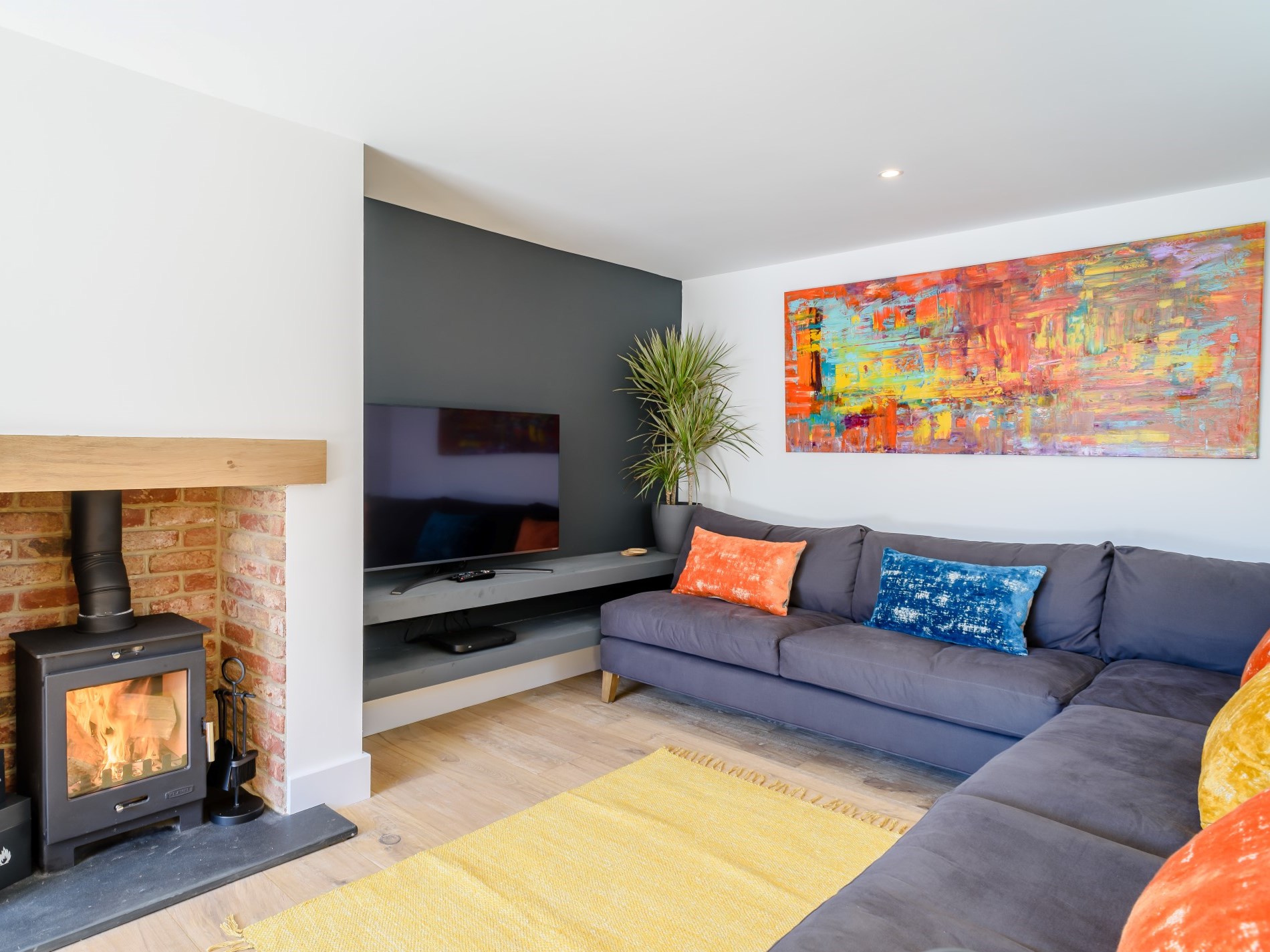 The lounge with woodburner at The Bude Coastal House, Bude