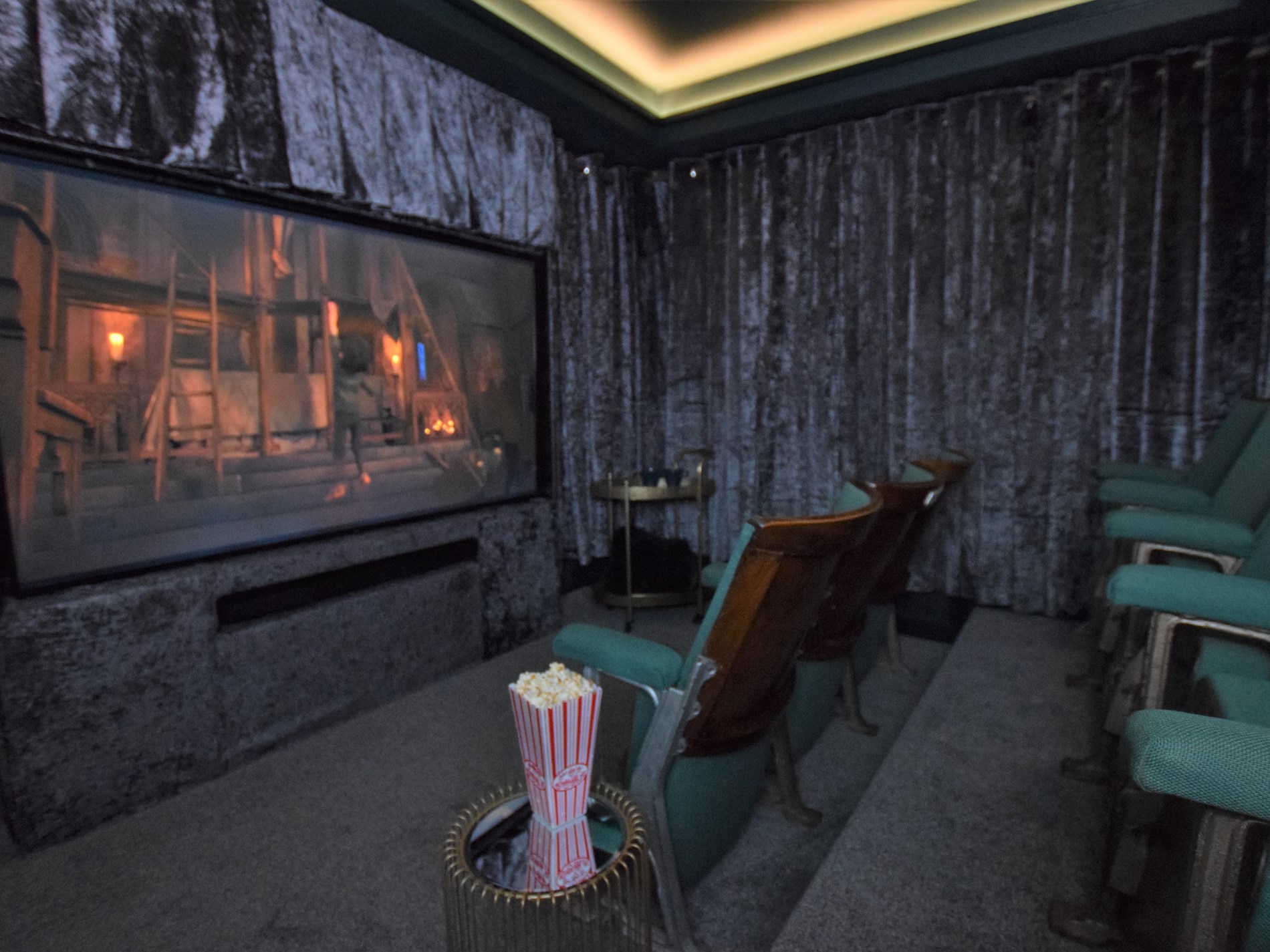 The home cinema room at The Appledore Townhouse with ten cinema seats