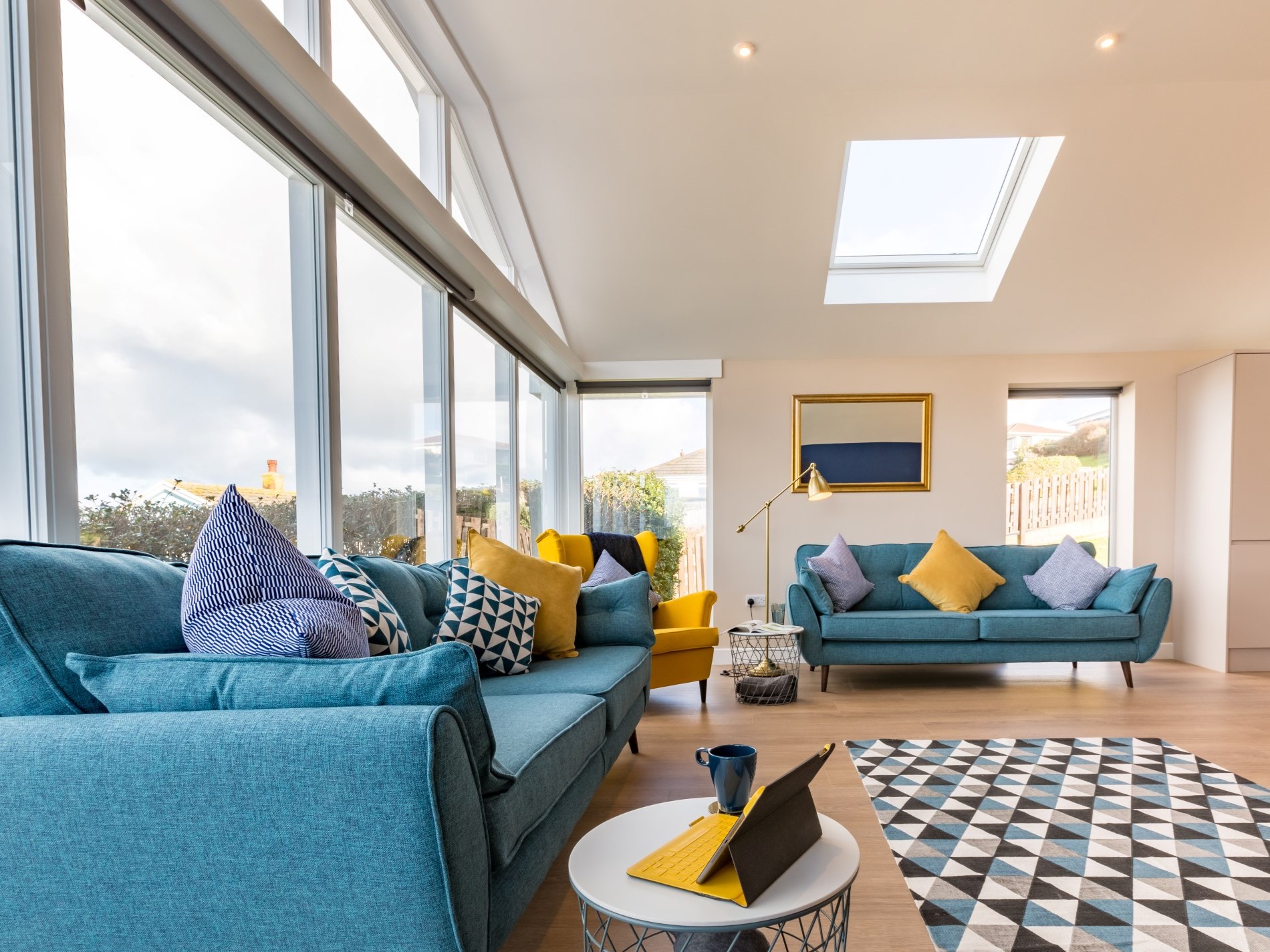 The living room at The Appledore Townhouse with floor-to-ceiling feature window