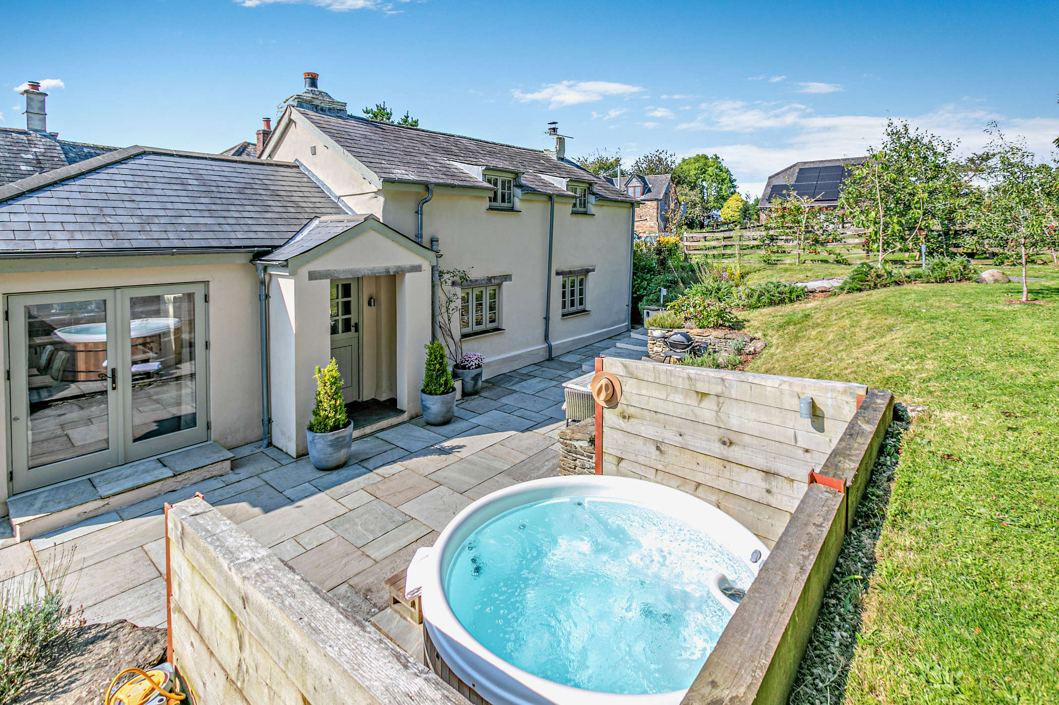 The hot tub beneath dark Cornish skies at The Looe Cottage, near Looe