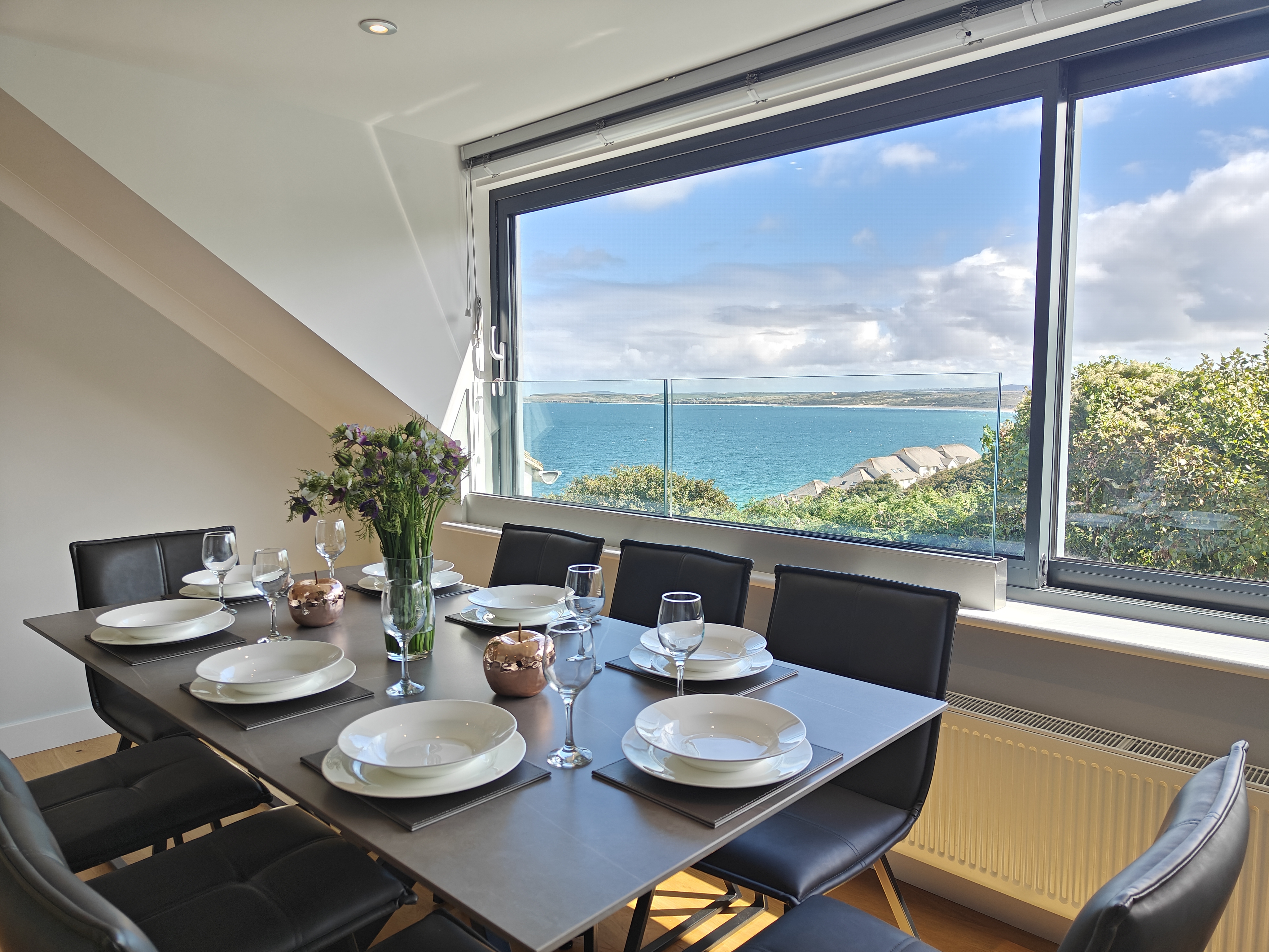 The first-floor dining room with rooftop and sea views at The Carbis Bay Garden House