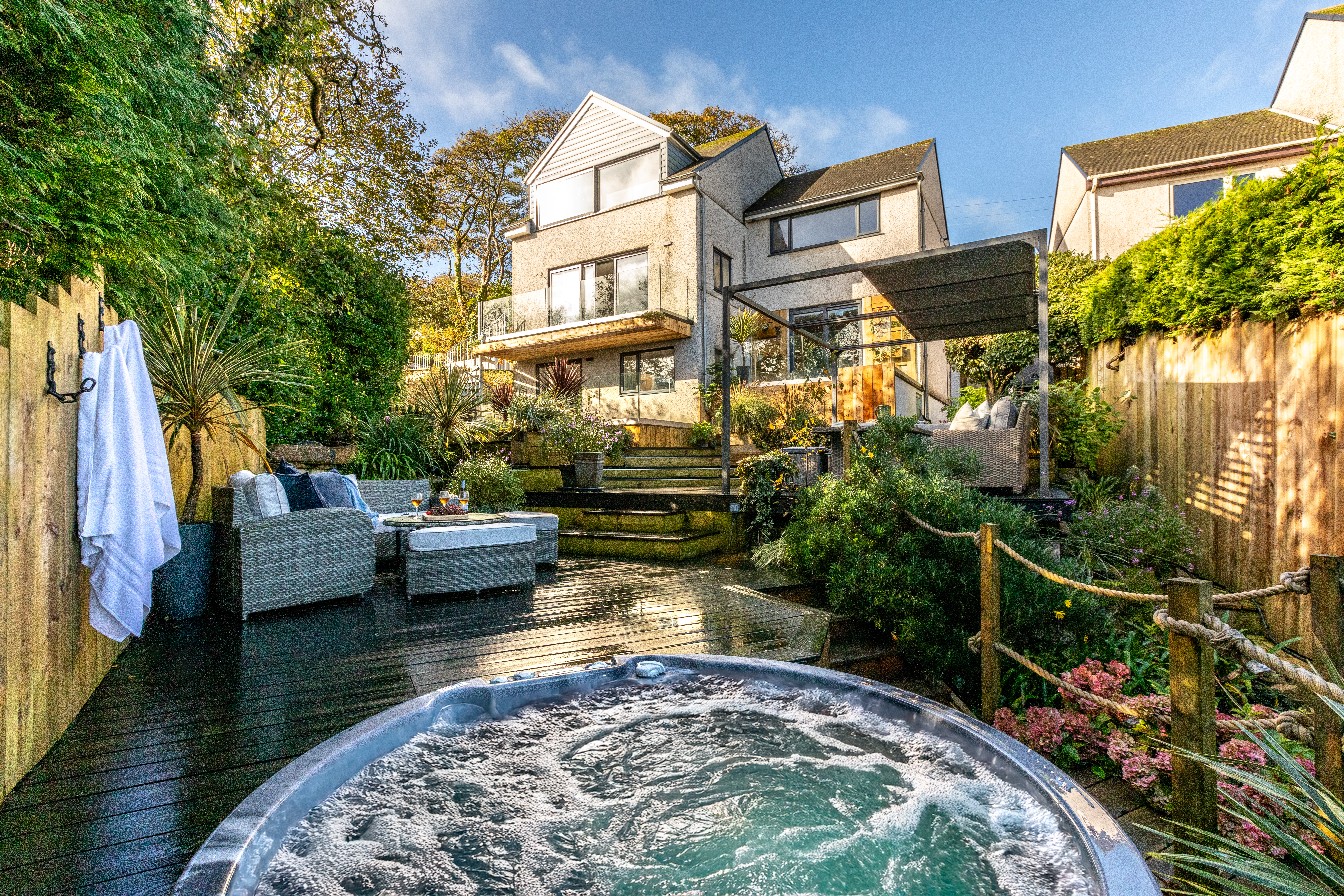 The tiered patio garden at The Carbis Bay Garden House coastal house, Cornwall