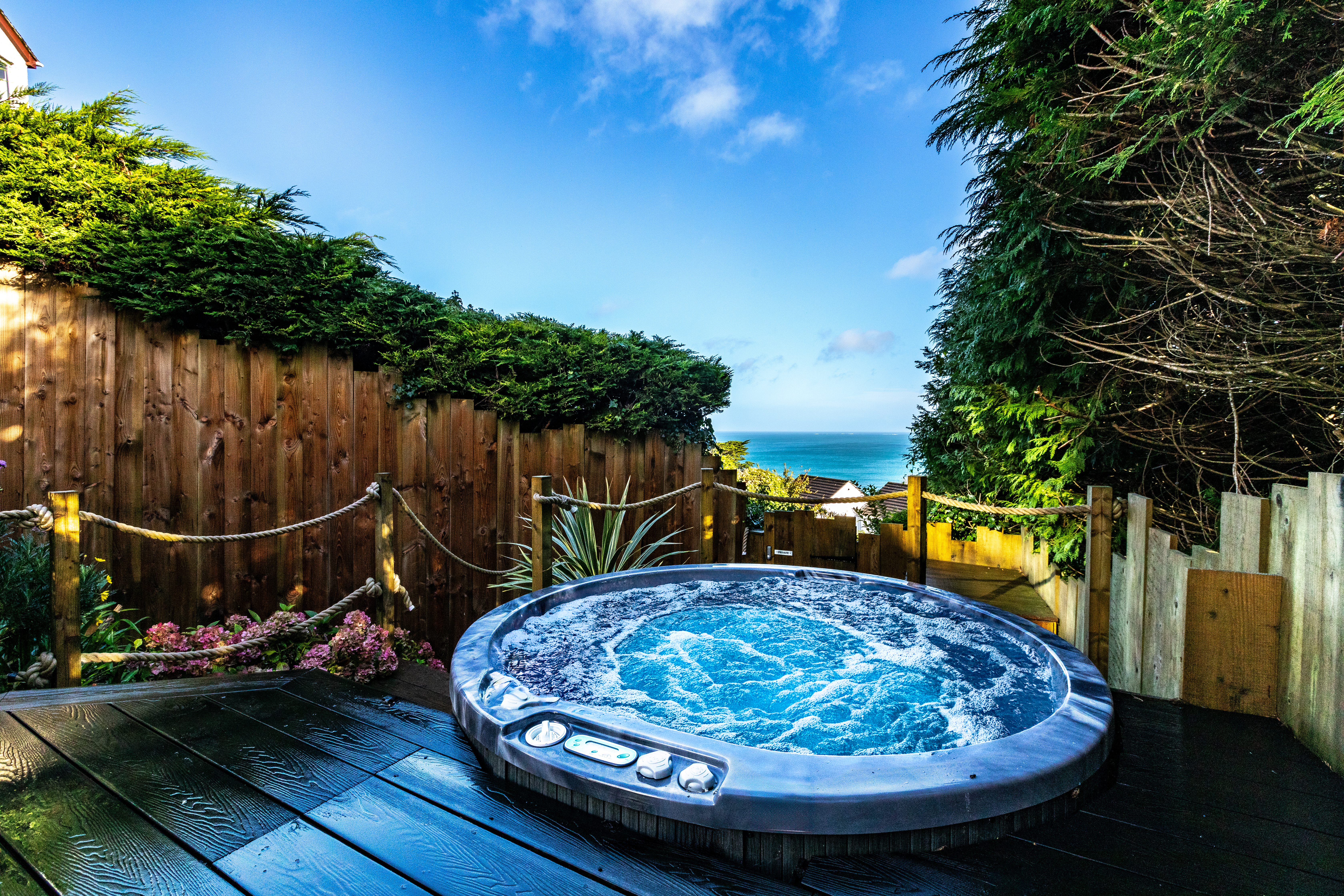 The hot tub on the tiered patio garden at The Carbis Bay Garden House