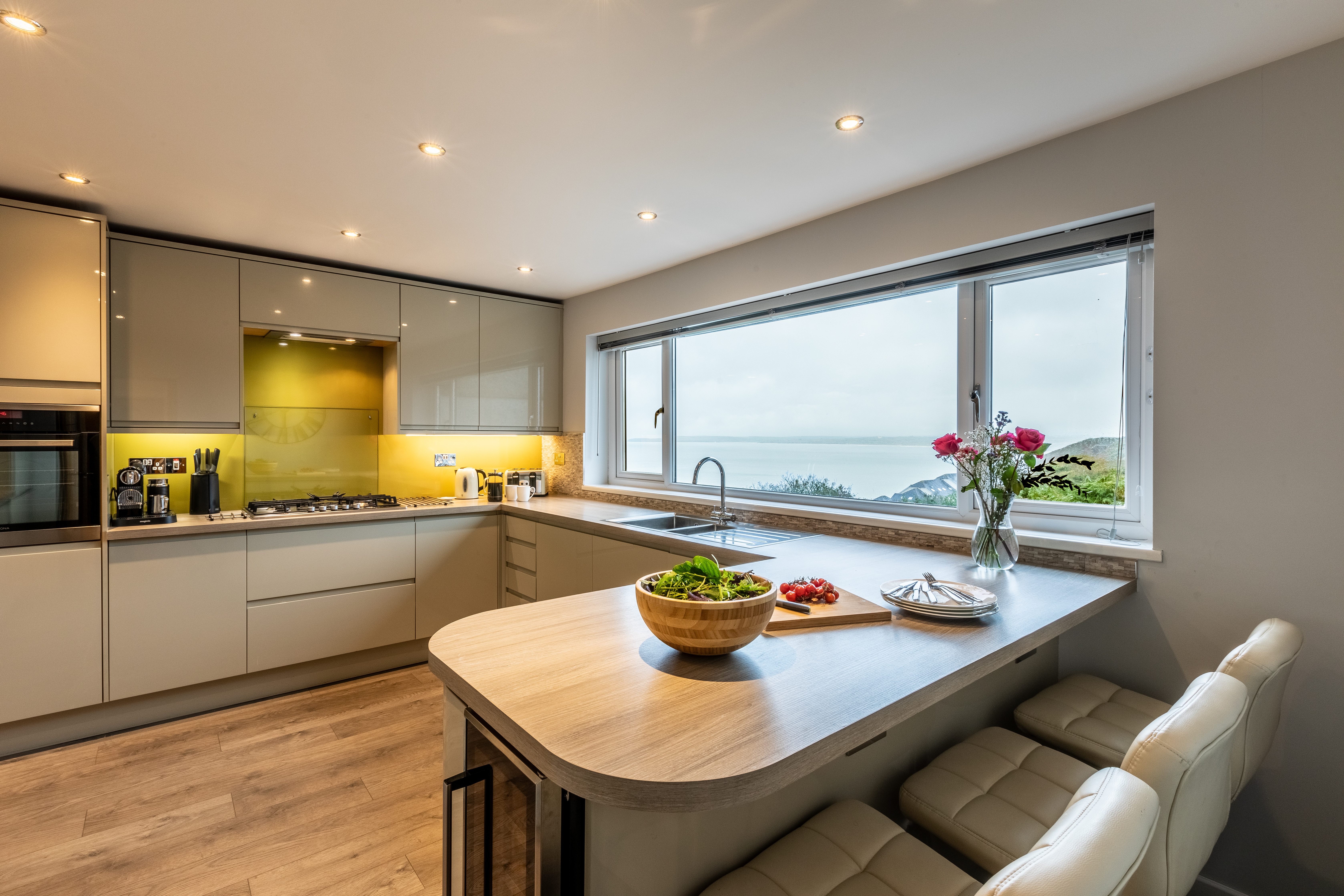 The contemporary kitchen flooded with natural sunlight at The Carbis Bay Garden House