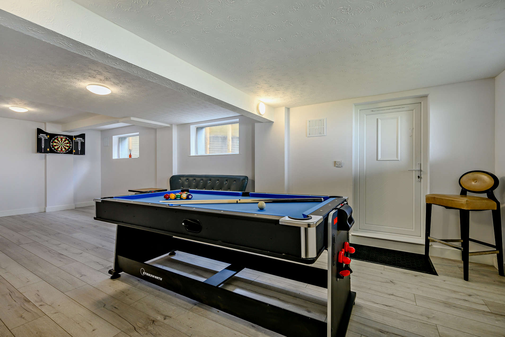 The games room at The Downderry Cottage House, Cornwall