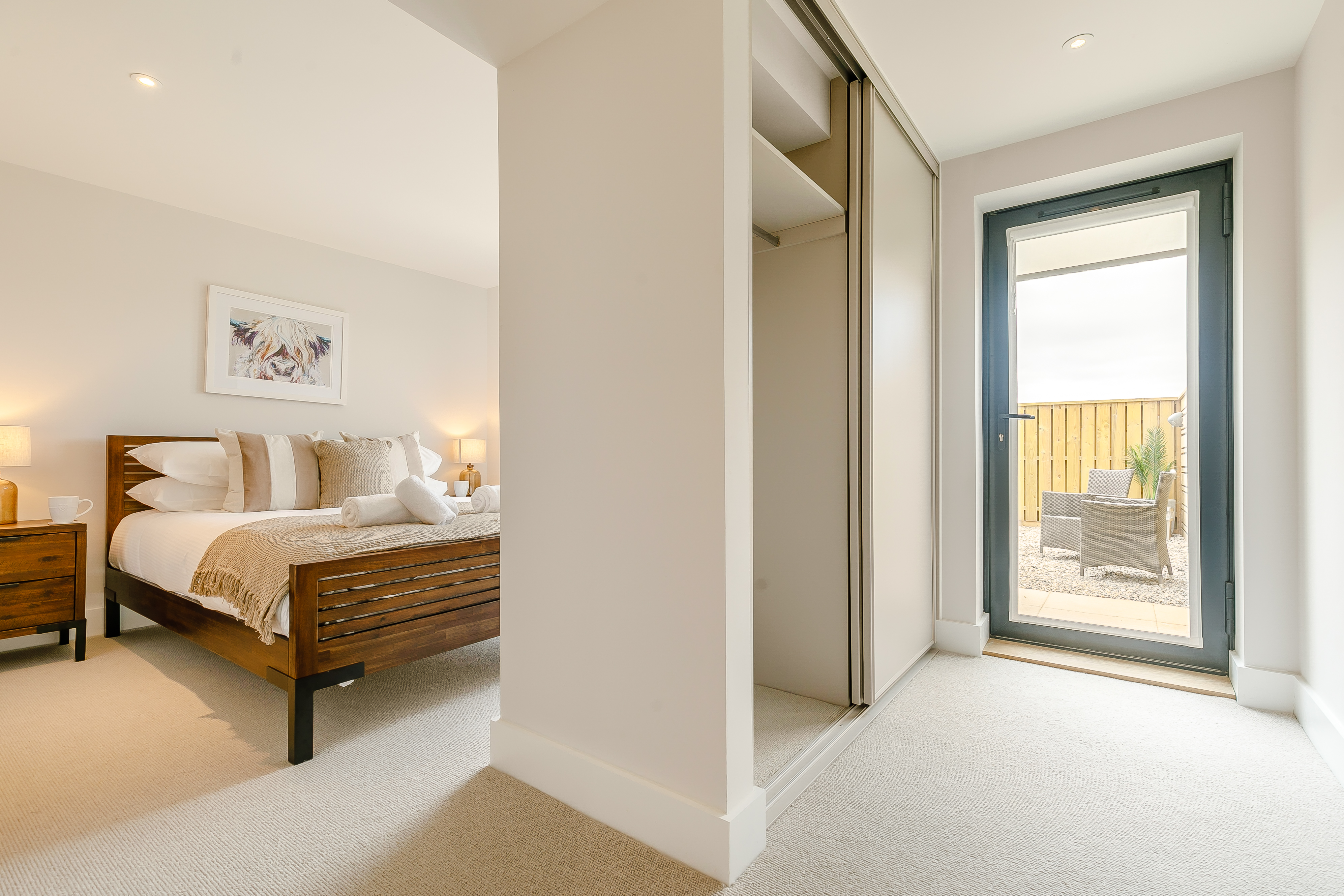 The master bedroom with garden access at The Newquay Apartment