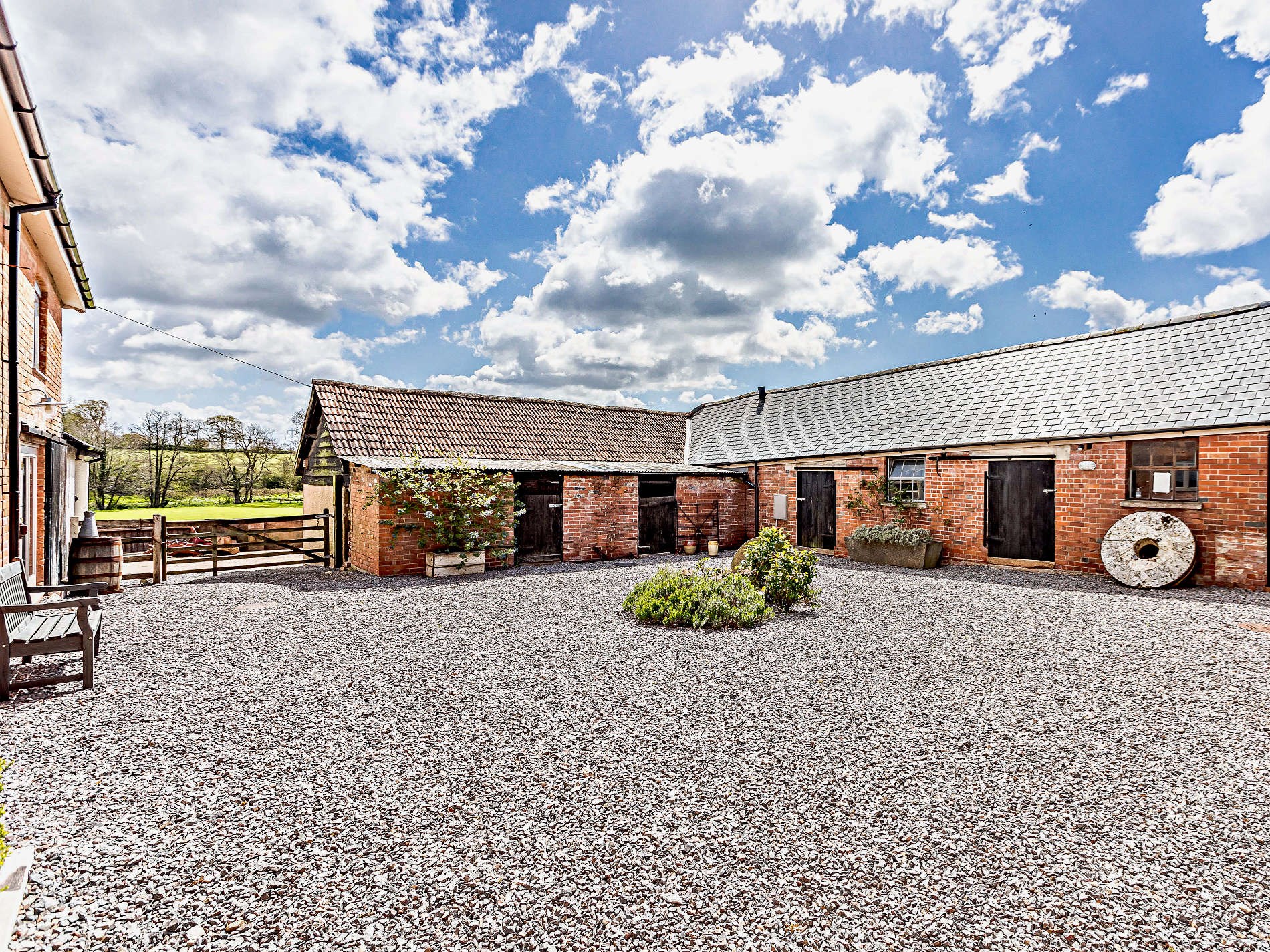 The barn conversion exterior at The Payhembury Farmhouse, set on a working farm in Payhembury