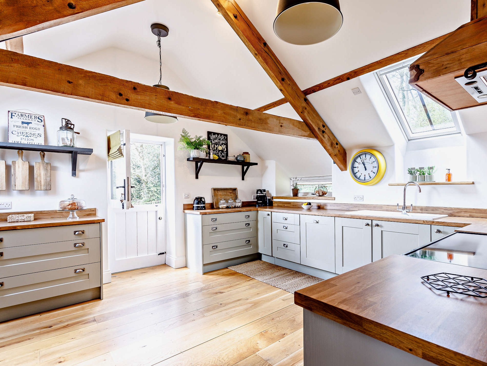 The well-equipped kitchen with hill views at The Payhembury Farmhouse