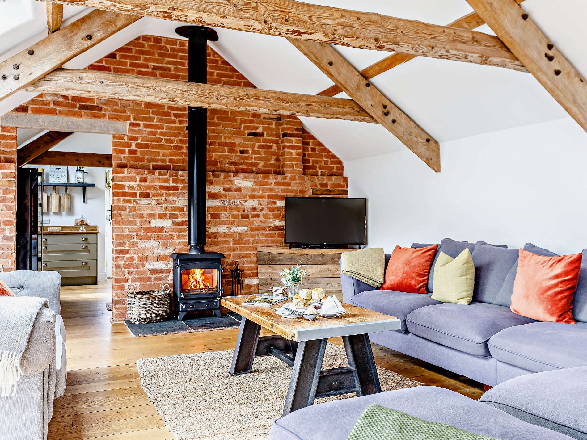 The lounge with woodburner at The Payhembury Farmhouse, Payhembury Devon