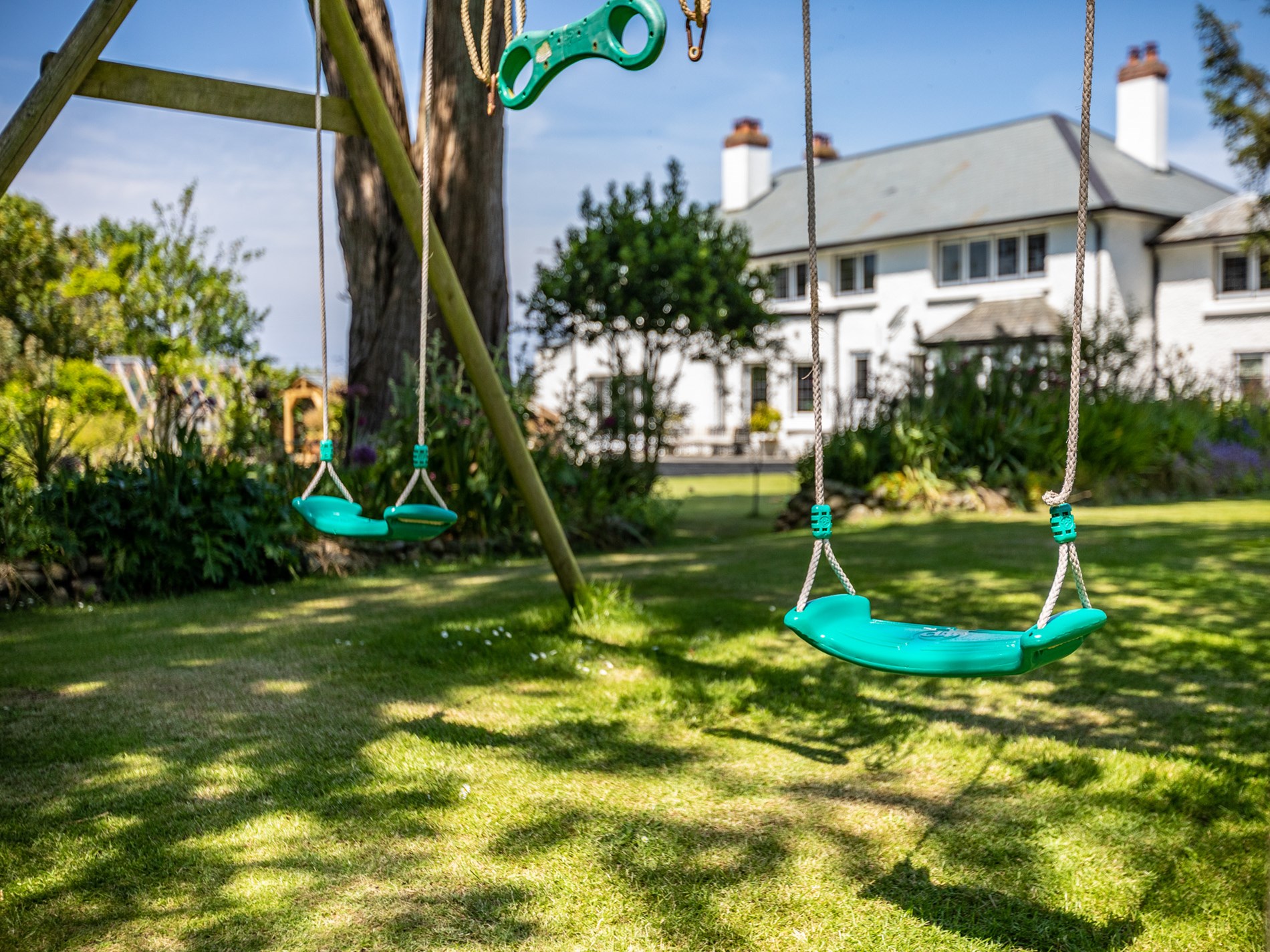 The children's swing and garden at The Bude House near Bude Cornwall